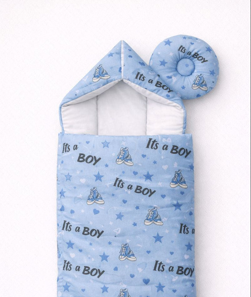 Blue baby swaddle with 'It's a Boy' text and booties on a white background