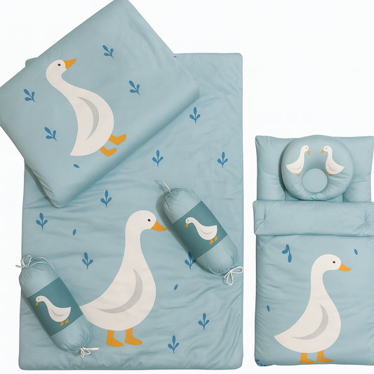 Children's bedding set with goose design on a light blue background