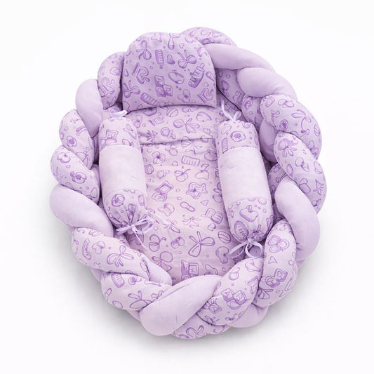 Purple braided baby nest with floral pattern on a white background